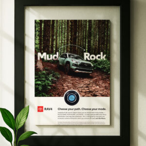 Framed original ad toyota rav4 in black floating frame on wall
