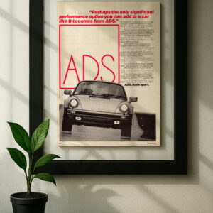 Porsche 911 ADS framed original ad in black floating frame on wall