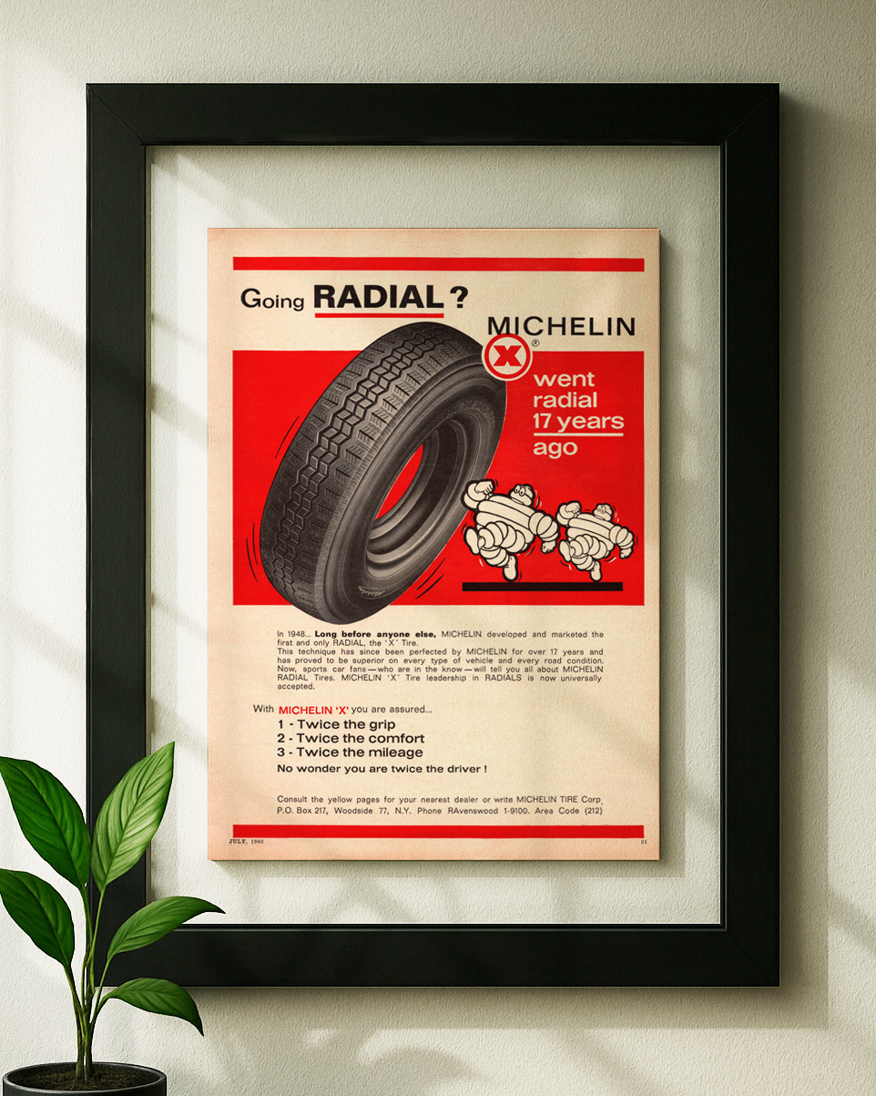 Michelin framed original ad in black floating frame on wall