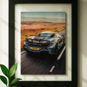 600lt mclaren framed original ad in black floating frame on wall