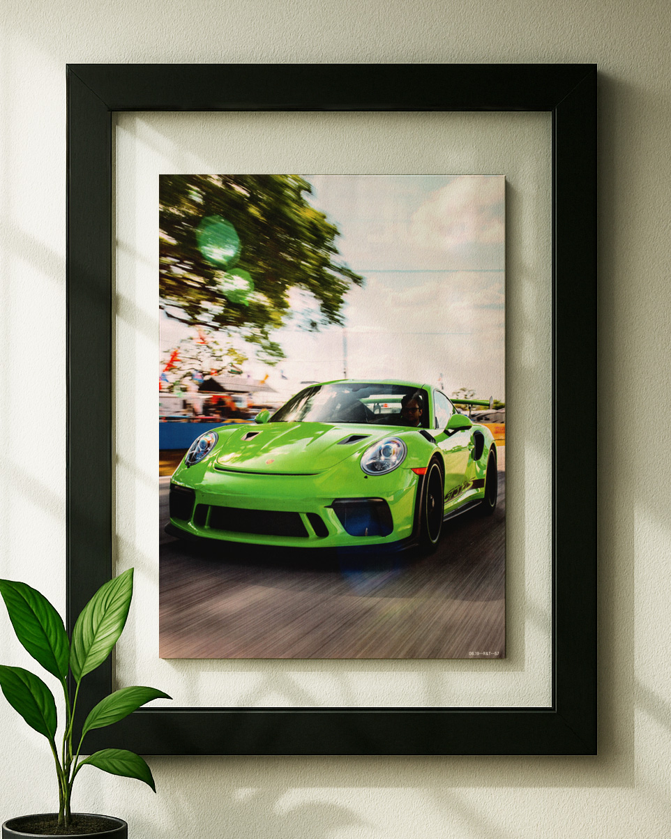 911 gt3rs framed python green framed original ad in black floating frame on wall
