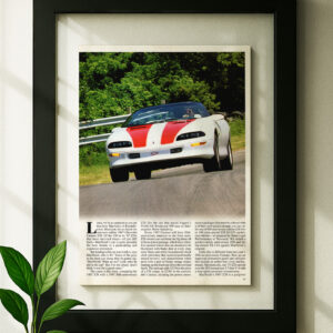 camaro z28 framed original ad in black floating frame on wall