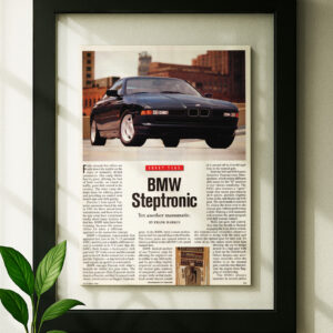 BMW E31 Steptronic framed original ad in black floating frame on wall