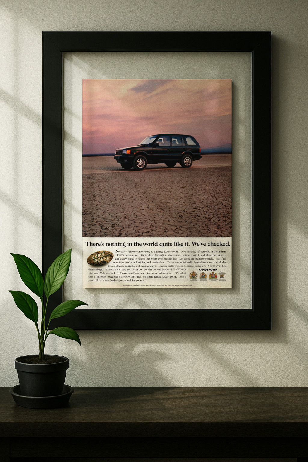 range rover land framed original ad in black floating frame on wall