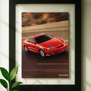 hyundai tiburon gt v6 framed original ad in black floating frame on wall