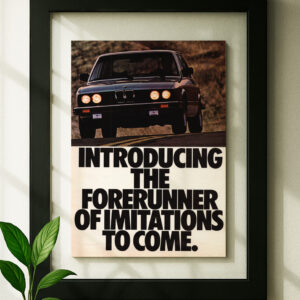 bmw e28 framed original ad in black floating frame on wall