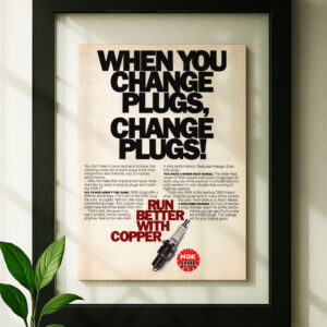 ngk spark plug framed original ad in black floating frame on wall