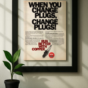 ngk spark plug framed original ad in black floating frame on wall