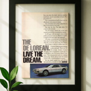 dmc delorean framed original ad in black floating frame on wall