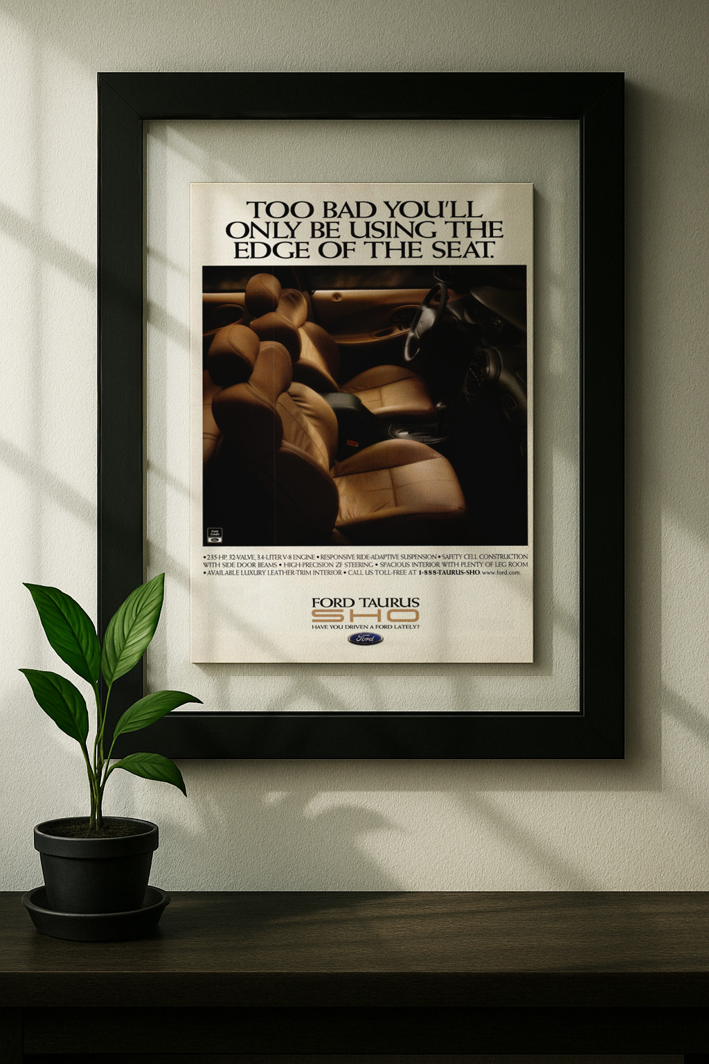 ford taurus sho framed original ad in black floating frame on wall